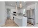 Bright kitchen features pendant lighting, stainless steel appliances, and an island at 32 Ocean Breeze Cir, Ormond Beach, FL 32176