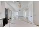 Open floor plan with expansive kitchen island featuring elegant marble countertop and stainless steel appliances at 32 Ocean Breeze Cir, Ormond Beach, FL 32176