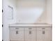 Laundry room with white cabinets and marble countertops at 32 Ocean Breeze Cir, Ormond Beach, FL 32176