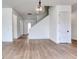Open-concept living room features tile floors, recessed lighting, and staircase at 32 Ocean Breeze Cir, Ormond Beach, FL 32176