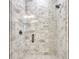Modern shower featuring decorative tile, glass enclosure, and sleek fixtures at 32 Ocean Breeze Cir, Ormond Beach, FL 32176