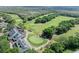 Aerial view of a golf course with surrounding homes and landscaping at 3205 Bailey Ann Dr, Ormond Beach, FL 32174