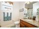 Charming bathroom with stylish vanity, decorative mirror, and beach-themed decor for a relaxing ambiance at 3205 Bailey Ann Dr, Ormond Beach, FL 32174