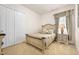 Comfortable bedroom with stylish furnishings, including a cozy bed, nightstand with lamp, and ample closet space at 3205 Bailey Ann Dr, Ormond Beach, FL 32174
