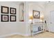 Beautiful entryway featuring golf-themed decor and a stylish console table at 3205 Bailey Ann Dr, Ormond Beach, FL 32174