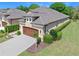 Beautiful home with a two-car garage, green lawn, and well-maintained landscaping at 3205 Bailey Ann Dr, Ormond Beach, FL 32174