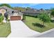 Attractive home exterior with a well manicured lawn and a two car garage at 3205 Bailey Ann Dr, Ormond Beach, FL 32174