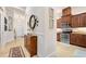 Inviting hallway adjacent to the kitchen with tile flooring and elegant decorations at 3205 Bailey Ann Dr, Ormond Beach, FL 32174