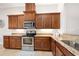 Beautiful kitchen featuring wood cabinets, granite countertops, and stainless steel appliances at 3205 Bailey Ann Dr, Ormond Beach, FL 32174