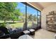 Relaxing screened lanai with comfortable seating and serene views of the lush outdoor landscape at 3205 Bailey Ann Dr, Ormond Beach, FL 32174