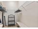 Spacious walk-in closet with wire shelving and a built-in bench, perfect for organizing clothes and accessories at 3205 Bailey Ann Dr, Ormond Beach, FL 32174