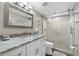Updated bathroom featuring a glass enclosed shower with a white vanity and marble countertop at 3370 Ocean Shore Blvd # 206B, Ormond Beach, FL 32176