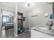 Cozy bathroom featuring a storage unit, light gray walls and wooden floors at 3370 Ocean Shore Blvd # 206B, Ormond Beach, FL 32176