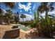 Outdoor bocce ball court surrounded by lush landscaping at 3370 Ocean Shore Blvd # 206B, Ormond Beach, FL 32176