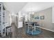 Inviting dining area with a chandelier and an adjacent kitchen, perfect for casual meals at 3370 Ocean Shore Blvd # 206B, Ormond Beach, FL 32176