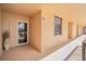 Exterior hallway showing the entrance door and the exterior windows at 3370 Ocean Shore Blvd # 206B, Ormond Beach, FL 32176