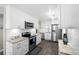 Well-lit kitchen with stainless steel appliances, granite countertops, and subway tile backsplash at 3370 Ocean Shore Blvd # 206B, Ormond Beach, FL 32176