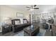Spacious living room open to the kitchen, featuring updated finishes and wood-look floors at 3370 Ocean Shore Blvd # 206B, Ormond Beach, FL 32176