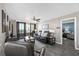Comfortable living room with access to a private balcony and a bedroom nearby at 3370 Ocean Shore Blvd # 206B, Ormond Beach, FL 32176