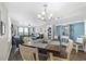 Bright and inviting living room featuring dining area and a partial view of the ocean at 3370 Ocean Shore Blvd # 206B, Ormond Beach, FL 32176
