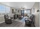 Relaxing living room with ocean views, a ceiling fan, and comfortable leather seating at 3370 Ocean Shore Blvd # 206B, Ormond Beach, FL 32176