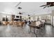Bright recreation room with tables, chairs, fireplace, and tv at 3370 Ocean Shore Blvd # 206B, Ormond Beach, FL 32176