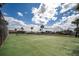 Outdoor community tennis courts behind secure fence at 3370 Ocean Shore Blvd # 206B, Ormond Beach, FL 32176
