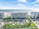 Aerial view showcasing the building's proximity to the beach and landscaping at 4631 S Atlantic Ave # 8706, Ponce Inlet, FL 32127