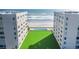Aerial view of the building with a pool and beachfront access at 4631 S Atlantic Ave # 8706, Ponce Inlet, FL 32127