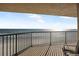 A spacious balcony with ocean views and a railing to enjoy the views from the comfort of your chair at 4631 S Atlantic Ave # 8706, Ponce Inlet, FL 32127