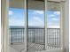 Balcony offers ocean view from behind sliding glass doors at 4631 S Atlantic Ave # 8706, Ponce Inlet, FL 32127