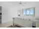 Bright bedroom with large sliding glass doors and ocean view at 4631 S Atlantic Ave # 8706, Ponce Inlet, FL 32127