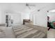 Bright bedroom with an ocean view, a ceiling fan, and neutral colors at 4631 S Atlantic Ave # 8706, Ponce Inlet, FL 32127
