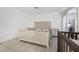 Bedroom with tile flooring and two dressers and a crib at 4631 S Atlantic Ave # 8706, Ponce Inlet, FL 32127