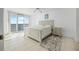 Bedroom with balcony access boasts ample natural light and neutral decor at 4631 S Atlantic Ave # 8706, Ponce Inlet, FL 32127