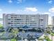 Beautiful exterior of the building with manicured landscaping and ample parking at 4631 S Atlantic Ave # 8706, Ponce Inlet, FL 32127