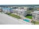 Aerial view of the building with ocean views and community pool at 4631 S Atlantic Ave # 8706, Ponce Inlet, FL 32127