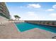 Resort-style oceanfront pool with brick patio and comfortable lounge chairs for relaxing and enjoying the views at 4631 S Atlantic Ave # 8706, Ponce Inlet, FL 32127