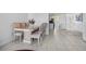 Cozy dining area with stylish table and chairs adjacent to the open kitchen at 4631 S Atlantic Ave # 8706, Ponce Inlet, FL 32127