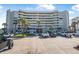Beautiful exterior view of a condo complex, showcasing ample parking and a grand entrance at 4631 S Atlantic Ave # 8706, Ponce Inlet, FL 32127