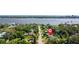 Aerial view of home with mature trees and proximity to the water, showcasing neighborhood at 48 Rosewood Ave, Ormond Beach, FL 32174