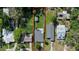 Aerial view of a home showcasing the backyard, surrounding greenery, and neighborhood layout at 48 Rosewood Ave, Ormond Beach, FL 32174