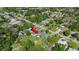 Aerial view of backyard featuring a well-maintained lawn and mature trees at 48 Rosewood Ave, Ormond Beach, FL 32174