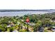 Aerial view of home with mature trees and proximity to the water, showcasing neighborhood at 48 Rosewood Ave, Ormond Beach, FL 32174