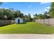 Spacious, fenced backyard featuring lush green grass, providing privacy and ample space for outdoor enjoyment at 48 Rosewood Ave, Ormond Beach, FL 32174