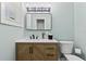 Stylish bathroom featuring a modern vanity with a marble countertop and a sleek mirror at 48 Rosewood Ave, Ormond Beach, FL 32174