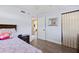 Comfortable bedroom featuring hardwood floors and neutral tones at 48 Rosewood Ave, Ormond Beach, FL 32174