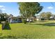 Beautiful home with a well-maintained lawn, mature trees, and inviting curb appeal at 48 Rosewood Ave, Ormond Beach, FL 32174
