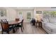 Cozy living room showcases wood floors, comfortable seating, and natural light from multiple windows at 48 Rosewood Ave, Ormond Beach, FL 32174