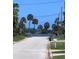 View of a quiet street leading to a waterfront area, showcasing the desirable location and neighborhood charm at 48 Rosewood Ave, Ormond Beach, FL 32174